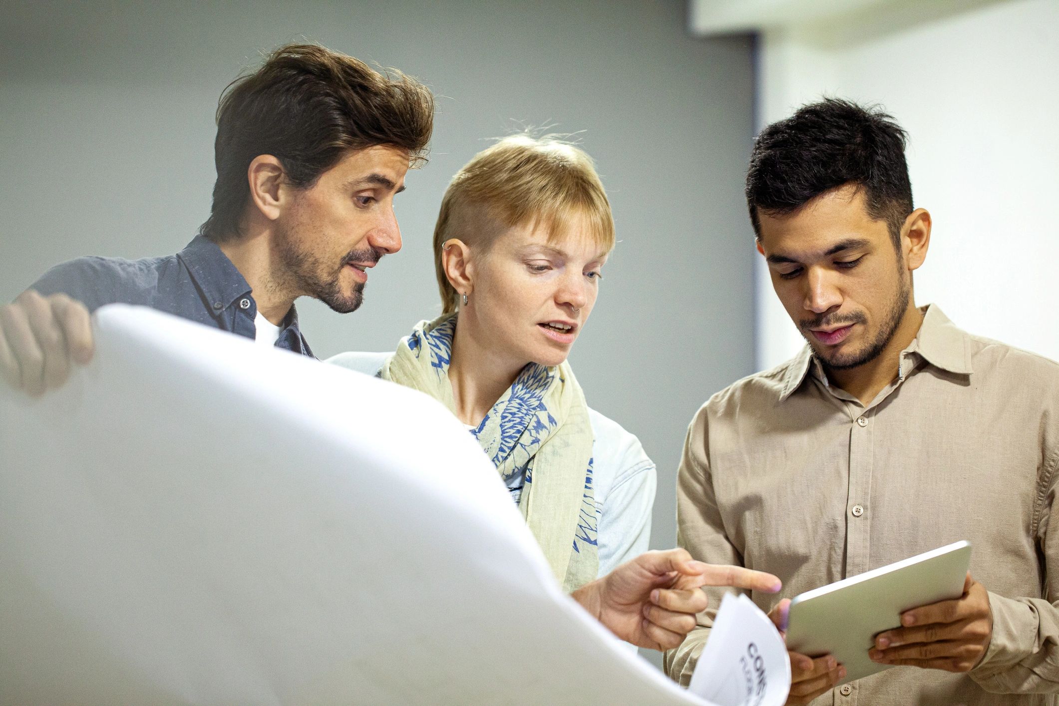Contractor reviewing renovation plans with homeowners