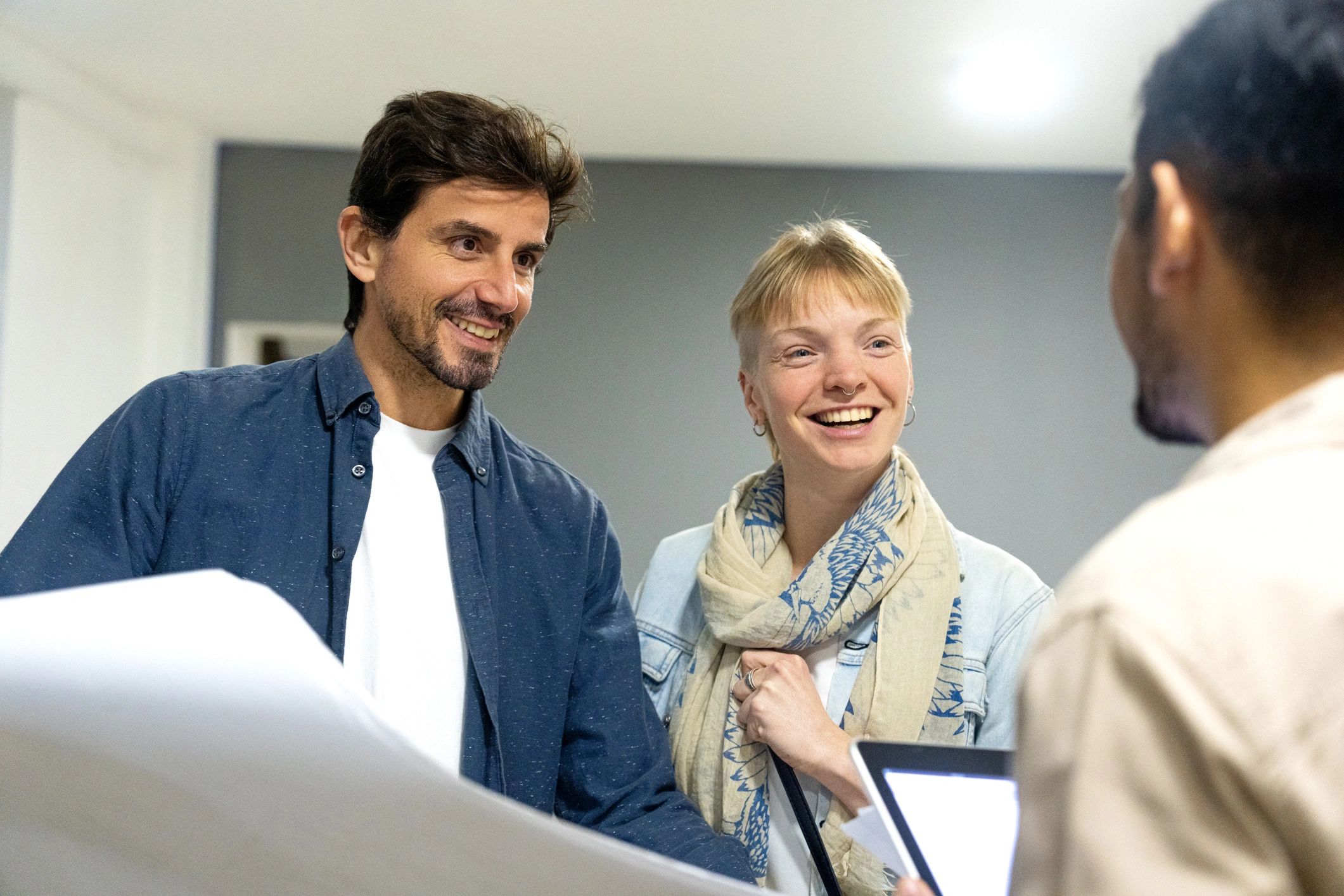 Homeowners discussing renovation plans with contractor